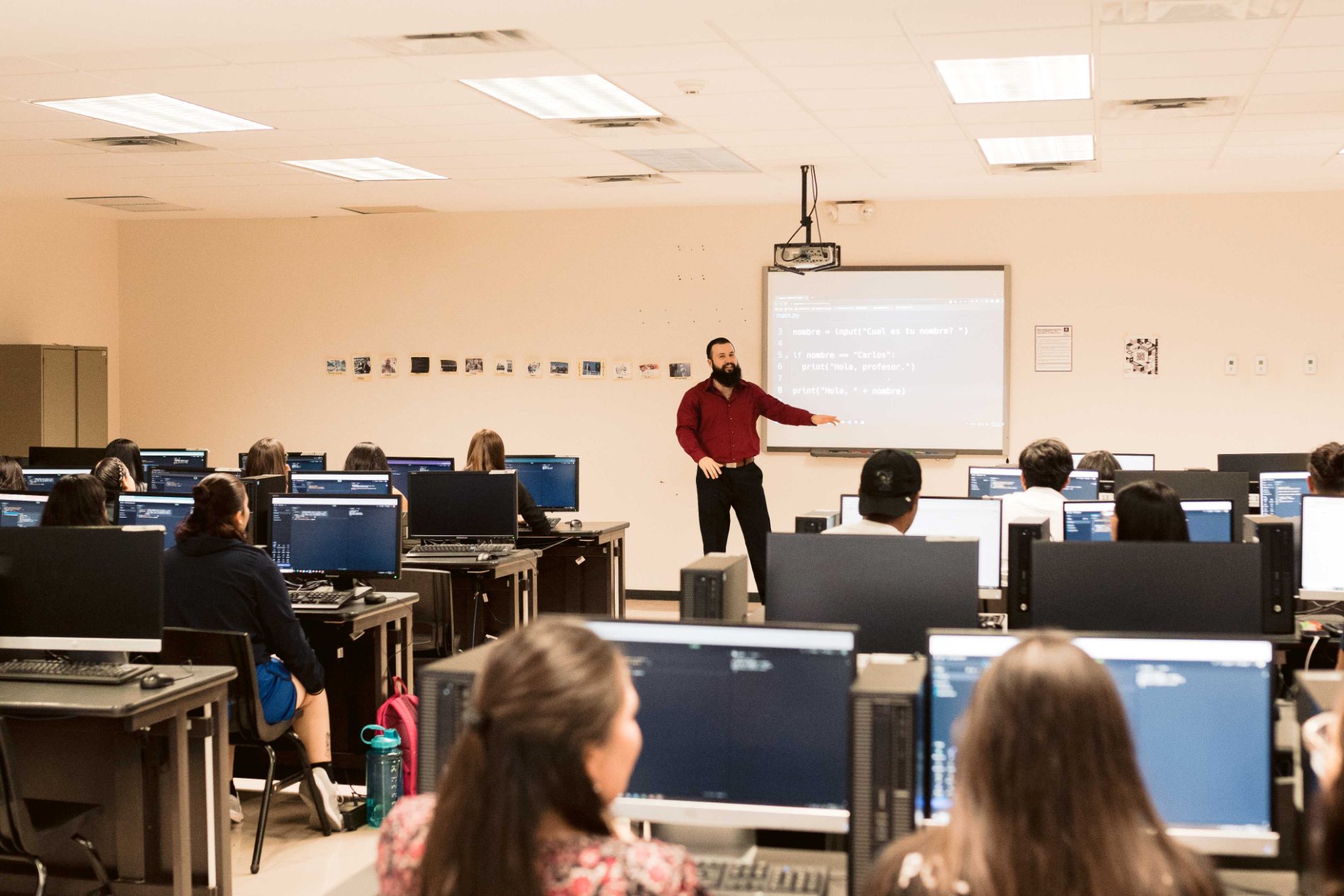 Carlos teaching a programming class